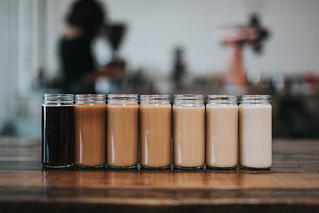 shallow focus photography of assorted coffee mixes in jars thumbnail