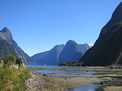 mountain and body of water at daytime thumbnail