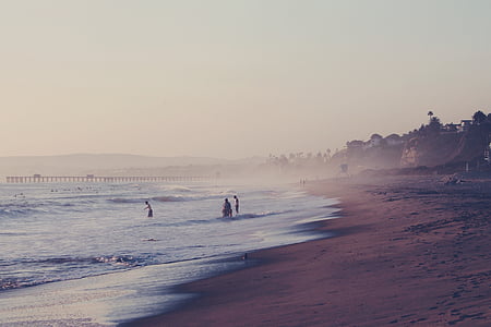 person swimming on beach thumbnail