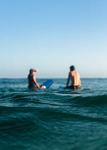 Two Person Riding Blue Bodyboard thumbnail