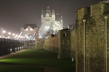 gray concrete building under gray sky during nighttime thumbnail