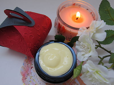 white rose flowers and pink tealight candle thumbnail