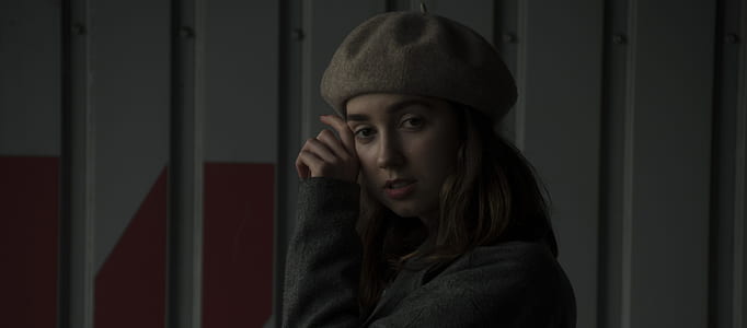 woman wearing black top and knit cap thumbnail