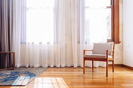brown wood-framed white padded armchair thumbnail