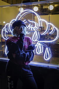 woman leaning on glass wall holding her chin thumbnail