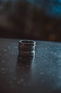 Three Silver-colored Rings on Black Surface thumbnail