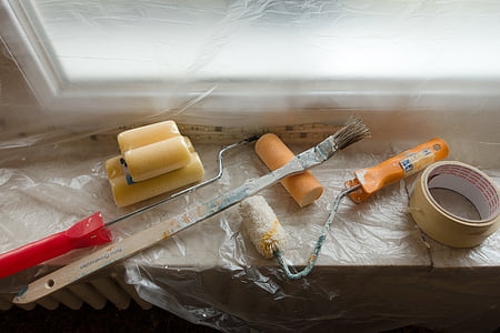 assorted paint brushes on brown surface thumbnail