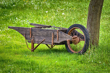 focus photo of brown wooden wheelbarrow thumbnail