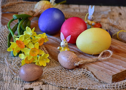 five assorted-color eater eggs on table thumbnail