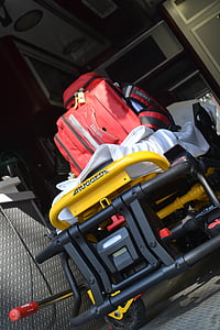 red bag on top of yellow cart thumbnail