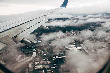 aerial photography of clouds and houses thumbnail