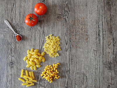 assorted pasta and tomato on table thumbnail