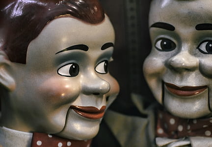 porcelain doll in front of mirror thumbnail