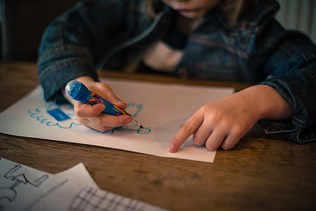 child drawing on white printing paper thumbnail