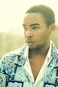Man in Blue and White Floral Button-up T-shirt thumbnail