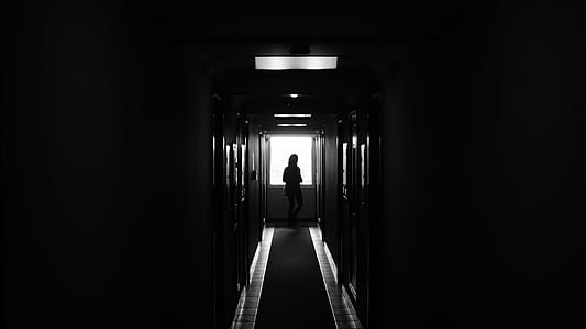 Person Standing on Dark Hallway thumbnail