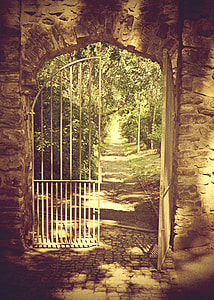 white gate and brick wall during daytime thumbnail