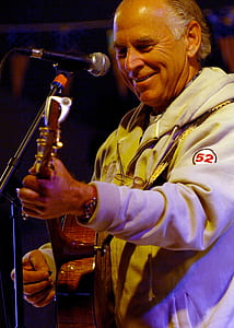 man playing guitar on stage thumbnail