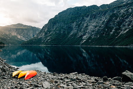 photography of mountain and body of water thumbnail