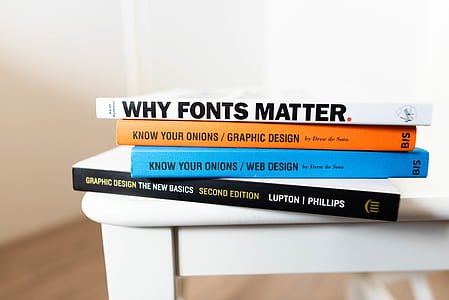 piles of book on white surface thumbnail