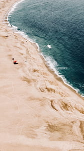 waves rushed to shore at daytime thumbnail