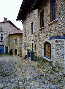 closed window of gray stone house thumbnail