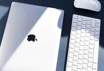 silver Macbook near keyboard thumbnail