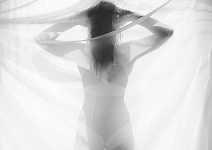 silhouette of woman from white mesh textile thumbnail