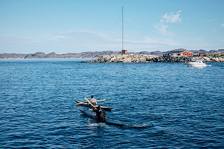 person riding boat on body of water thumbnail