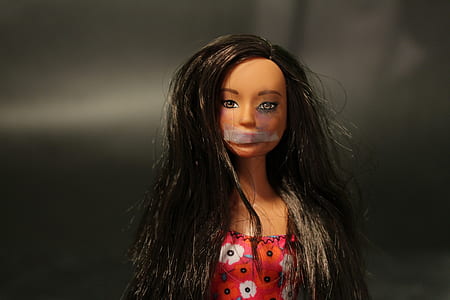 selective focus photography of black-haired Barbie doll thumbnail