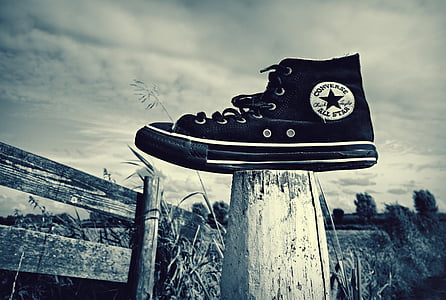 unpaired black Converse All-Star high-tops thumbnail
