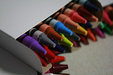 selective focus photography of assorted-color crayons in white box thumbnail