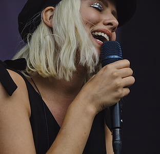 woman with short white hair singing thumbnail