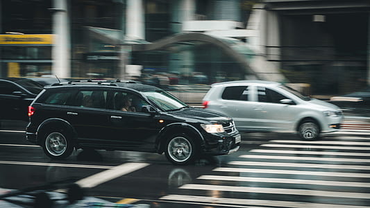 Black Suv Beside Grey Auv Crossing the Pedestrian Line during Daytime thumbnail