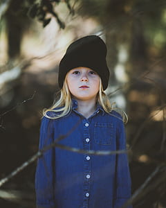 girl wearing blue denim button-up collared jacket and black knit cap thumbnail
