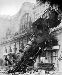 grayscale of train near building photography thumbnail