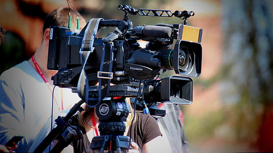 person using black camera thumbnail
