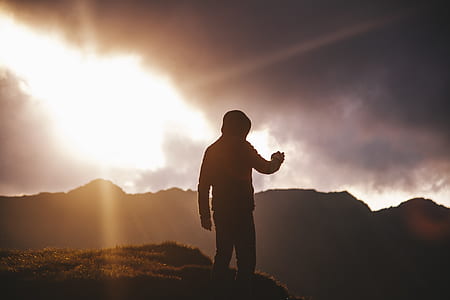 silhouette of man in hoodie standing on holl thumbnail