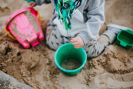 Toddler playing in the sand thumbnail