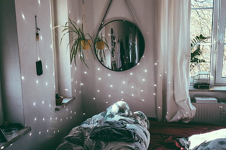 round wall mirror on white wall thumbnail