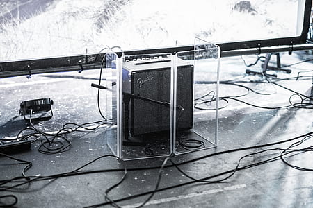 black Fender guitar amplifier inside clear plastic cover thumbnail