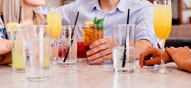 three person beside table with drinking glass on the table thumbnail