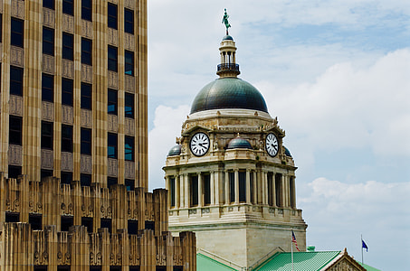 photo of tower with clock during day time thumbnail