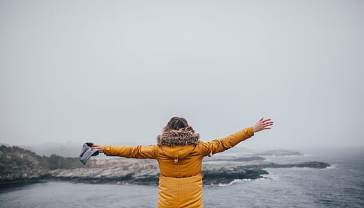 woman raising her hands thumbnail
