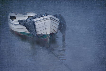 gray rowboat on body of water thumbnail