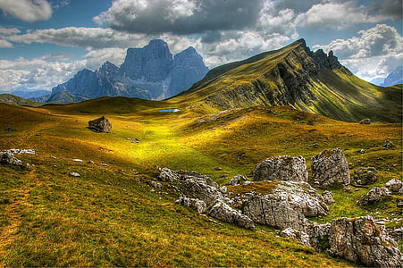 green covered grass mountain under white clouds thumbnail