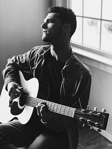 man playing acoustic guitar thumbnail