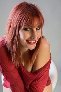 woman sitting in red chair thumbnail