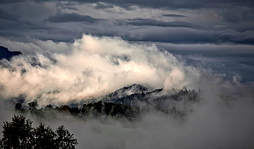 cumulus clouds surrounding mountain thumbnail