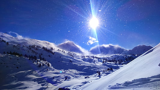 snow field during daytime thumbnail
